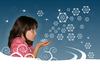 Girl blowing snowflakes