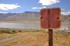 Blank sign at lakeshore