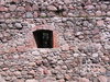 Old stone wall with window