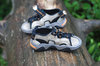 Wet sandals with sand grains 1