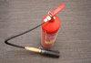 A stored-pressure fire extingu