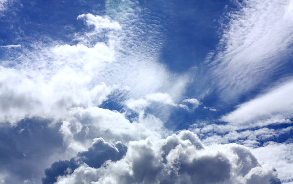 Blue and Cloudy Skies: Snapshots of a clear blue sky with white puffy clouds