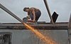 Worker grinding