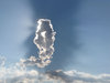 sun behind cloud