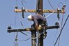 Man Replacing Power Pole