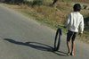 Boy pushing wheel