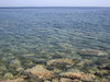 Placid sea, rocky bottom