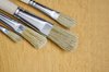 Brushes on wooden background