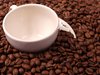 Coffee beans and an espresso c