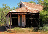 abandoned rusty bush shed