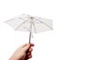 Holding small white umbrella