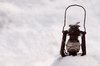 Paraffin lamp in snow