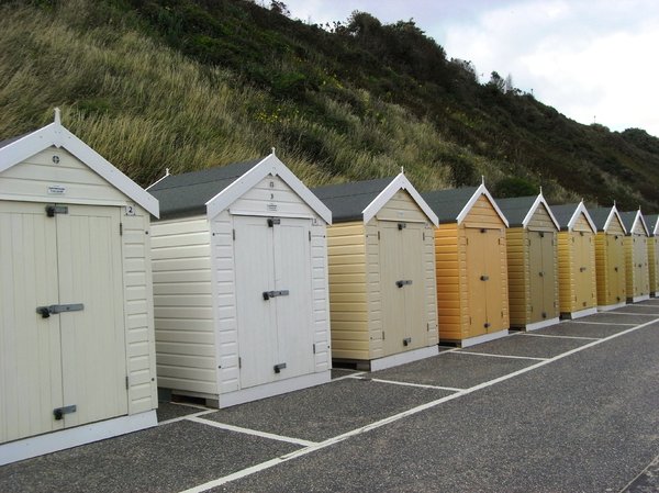 Beach huts: Multi-coloured beach huts along Bournemouth beach.