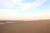 Lone walker on beach