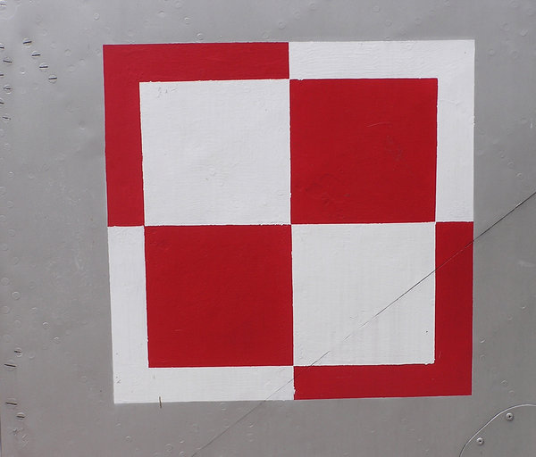 Polish Air Force checkerboard: The Air Force checkerboard is a national marking for the aircraft of the Polish Air Force, equivalent to roundels used in other nations' air forces.