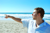 Man Points on the Beach