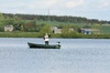 Man on a boat, fishing
